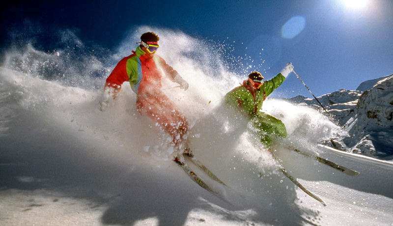 Dan and John Egan powder skiing