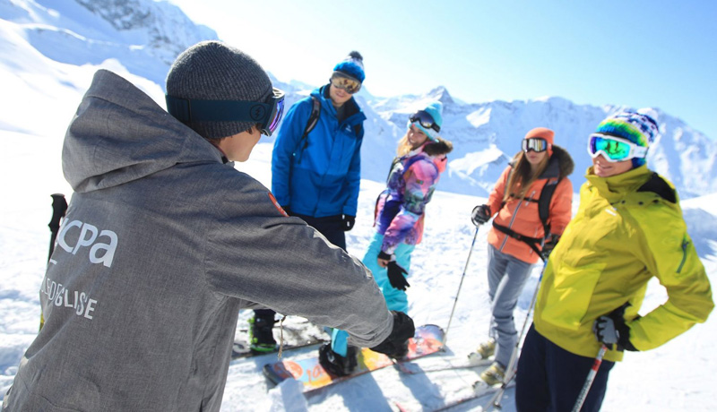 UCPA ski instructor with clients